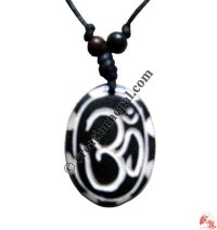 Tibetan OM black oval amulet