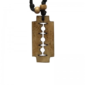Traditional razor blade carved bone pendent