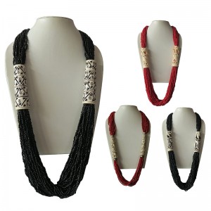 Carved bone pipe attached pote necklace 