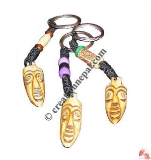 Human man face carved bone key-ring