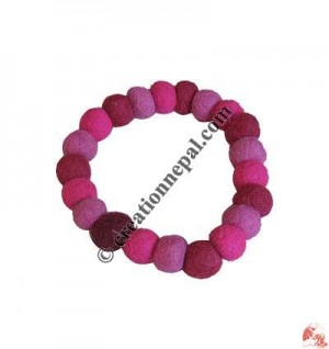 Small plain felt balls wrist band 1