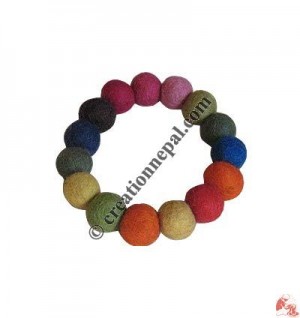 Small plain felt balls wrist band 2