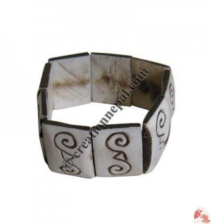 Double spiral carved bracelet