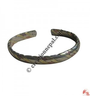 Mixed metal beaten bangle