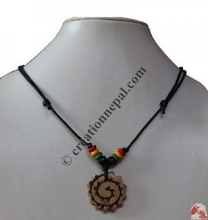Chakra carved bone pendant