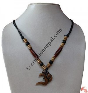 Om cut out bone pendant