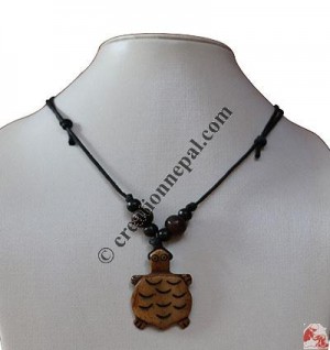 Turtle cut out bone pendant
