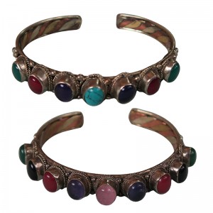 7-stone mixed metal bangle