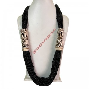 Elephant carved bone pipes attached black pote necklace