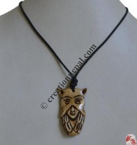 Unique face carved bone pendant